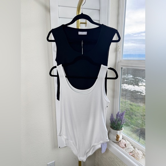Mangopop Tops - Mangopop Bodysuits. Bundle of 2. 1 NWT & 1 NWOT. Black and White Bodysuits